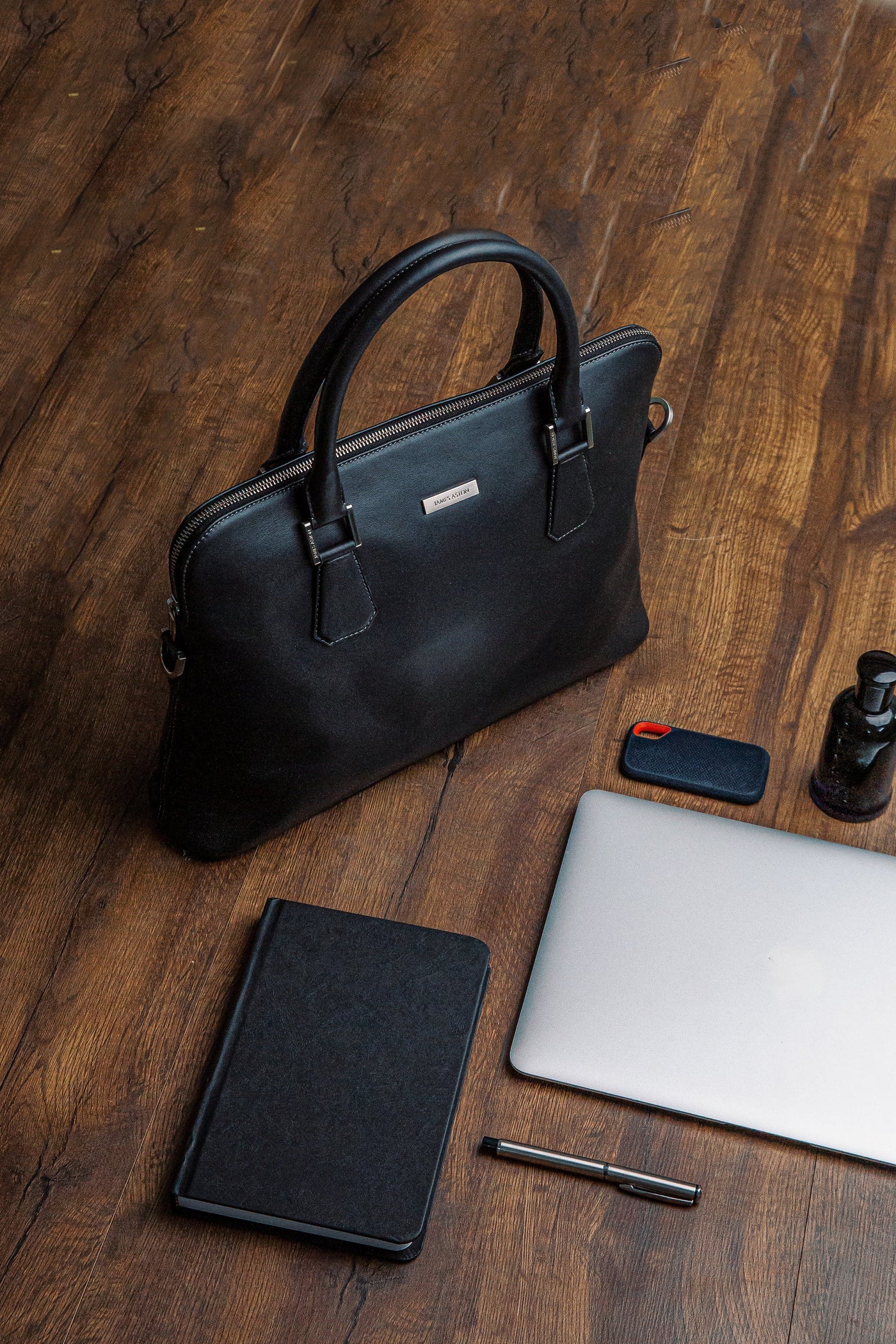 The Executive Laptop Bag in black, carried for the day.
