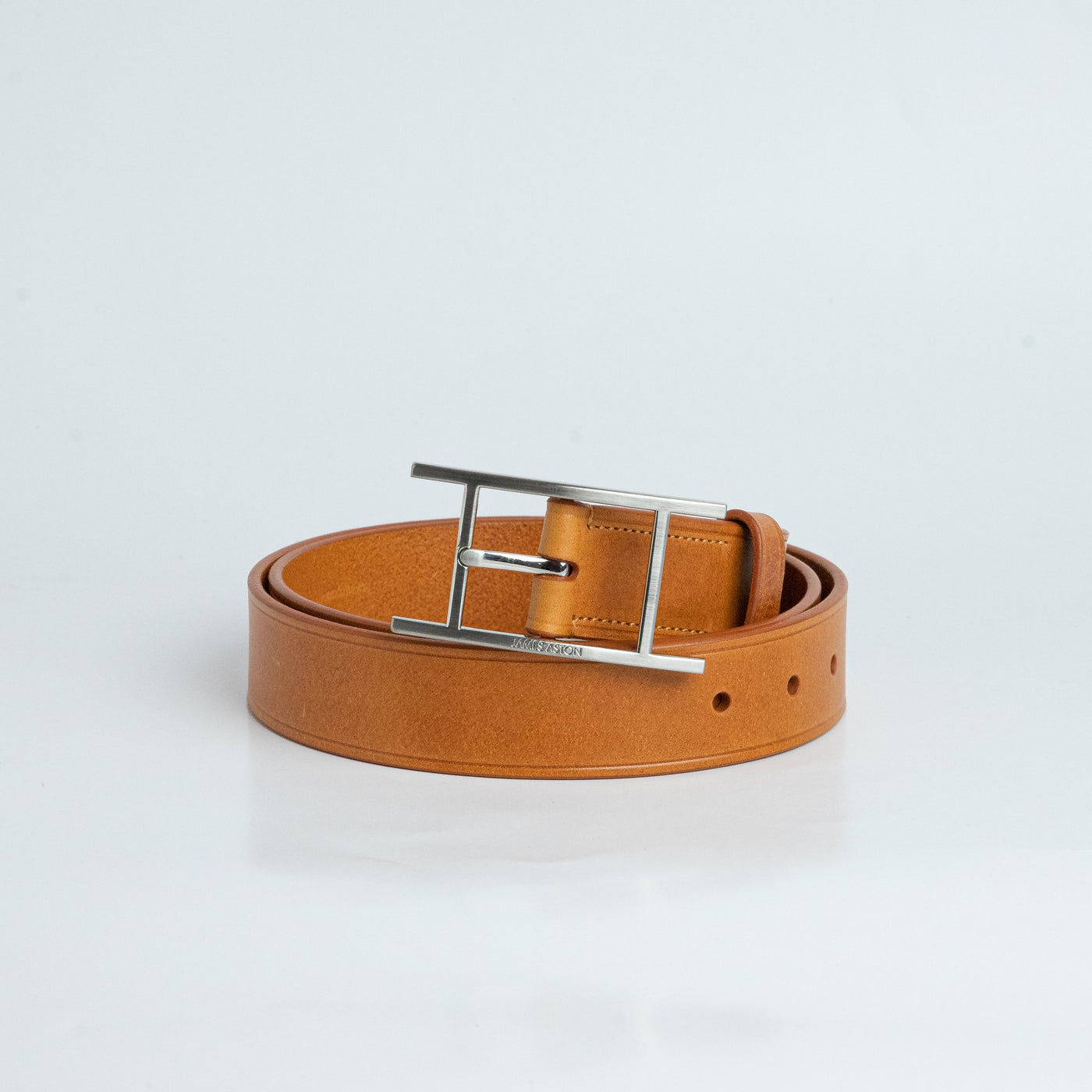 The Leone belt in Tan, composed