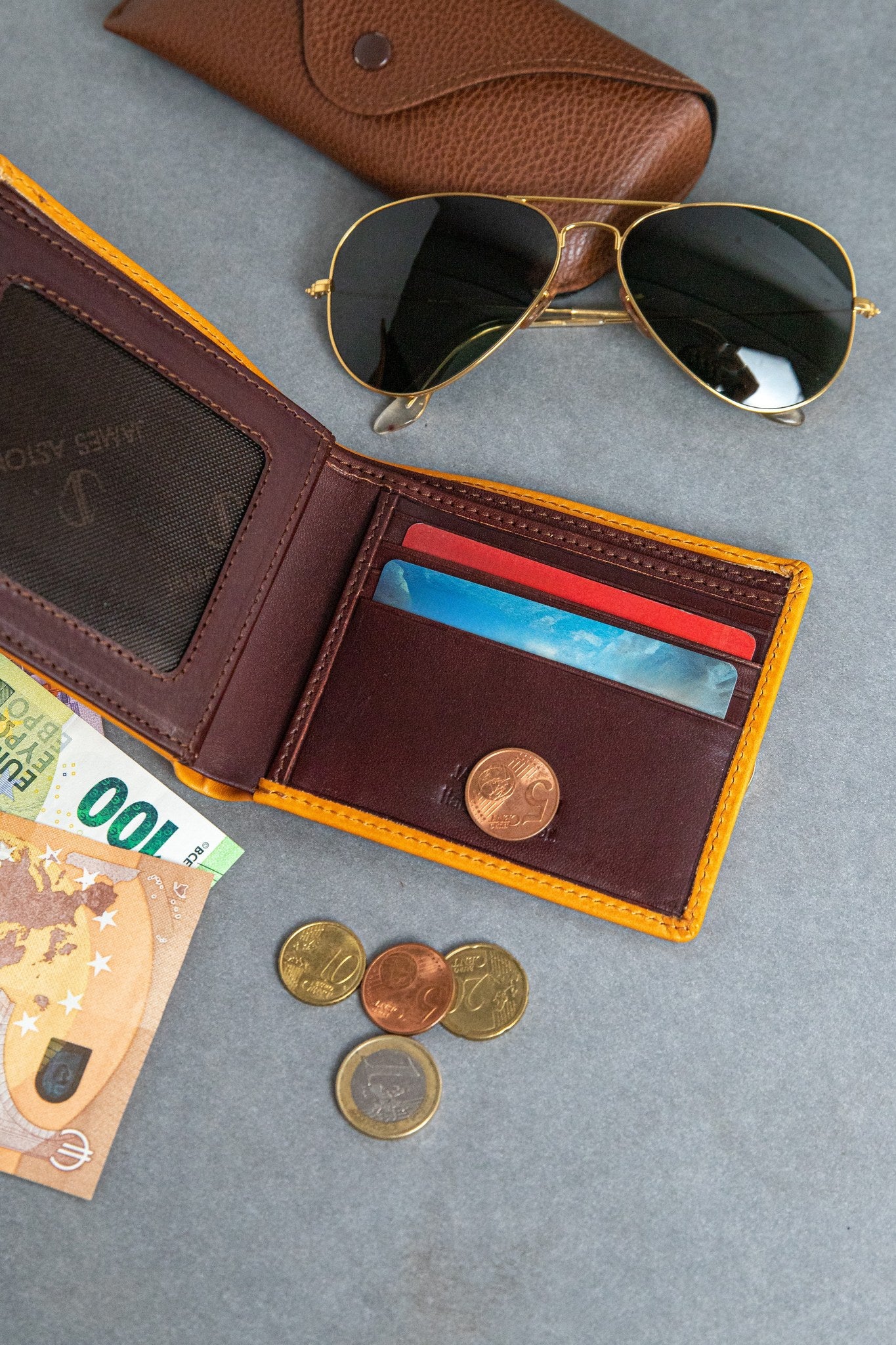 The smooth Vachetta leather of the Zanebono With Flap I wallet in tan.