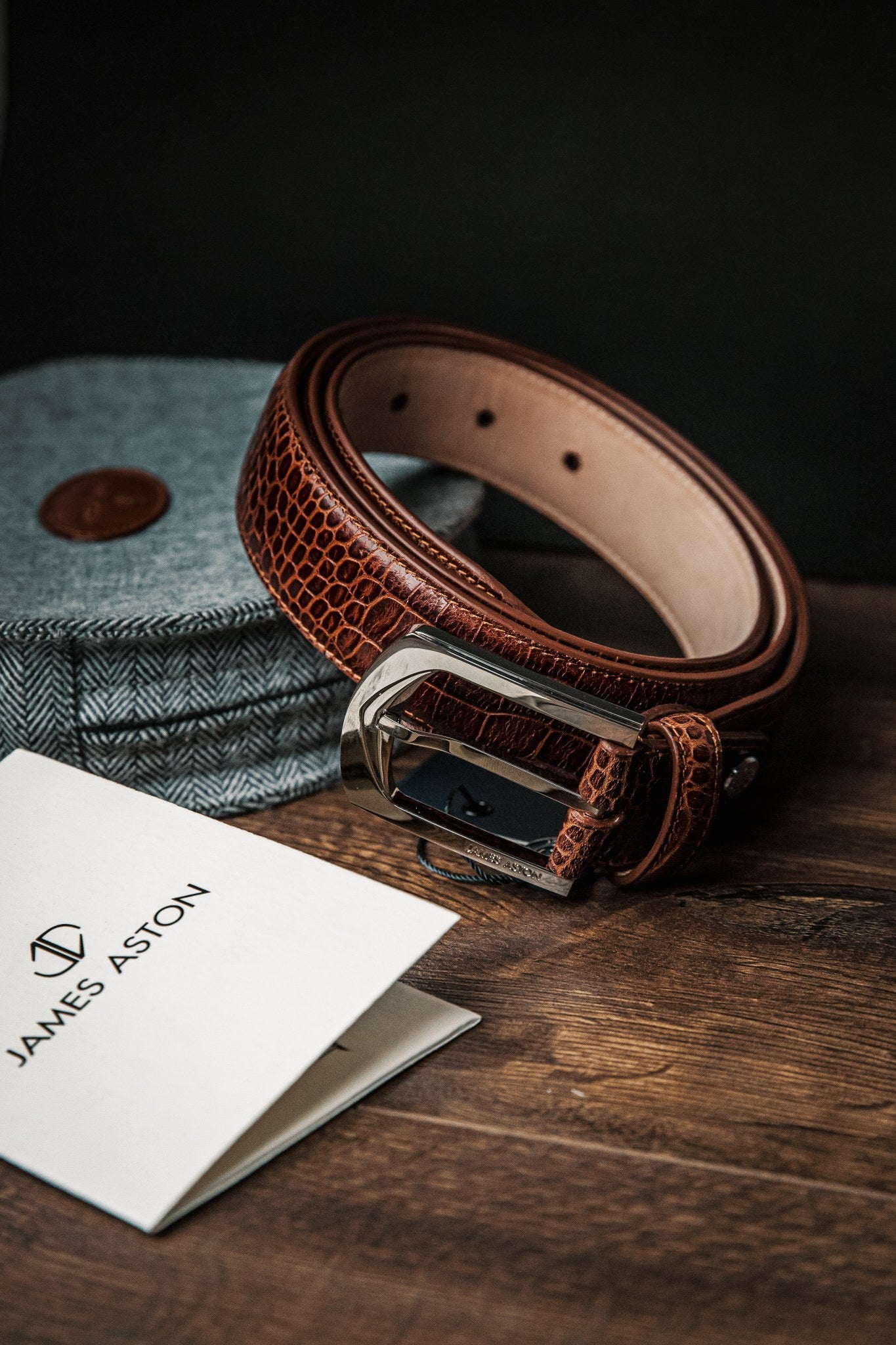 The Alessandro dress belt in cognac embossed leather, a second composed study.