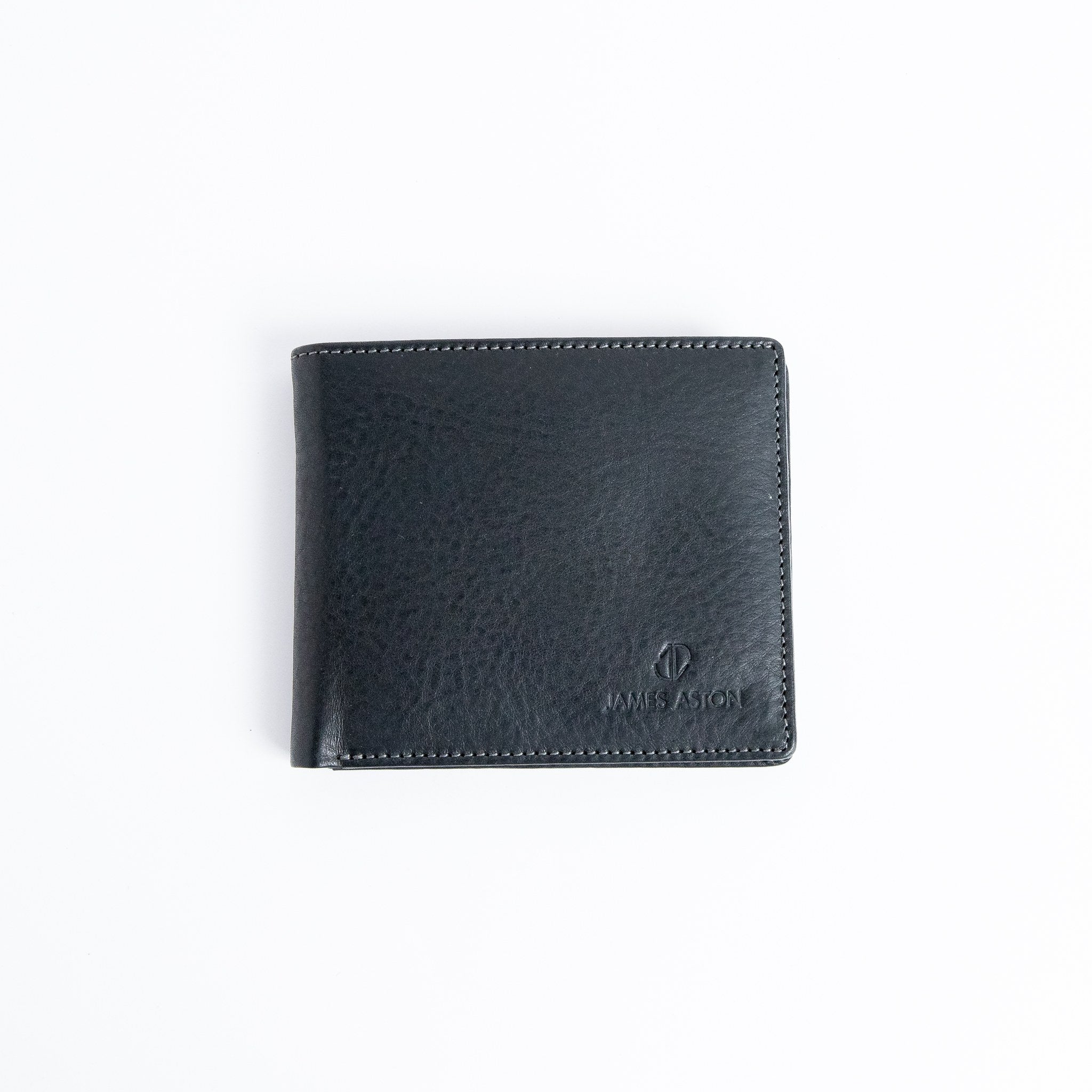 The Alonzo bifold wallet in black milled Vachetta leather, closed.