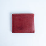 The back of the Alonzo bifold wallet in red milled Vachetta leather.