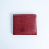 The back of the Alonzo bifold wallet in red milled Vachetta leather.