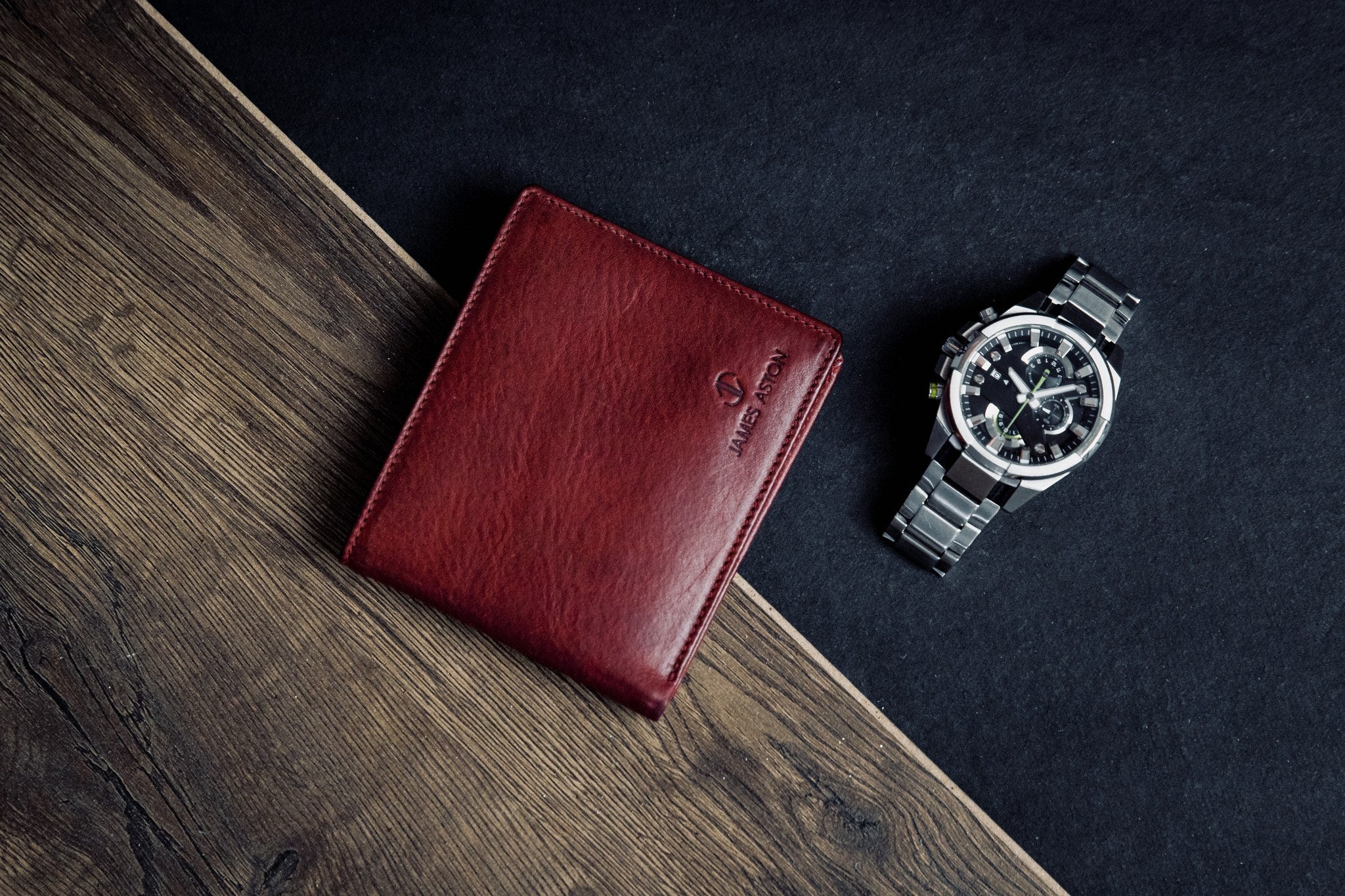 The milled Vachetta leather of the Alonzo bifold wallet in red.