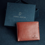 The Alonzo bifold wallet in red milled Vachetta leather, composed.