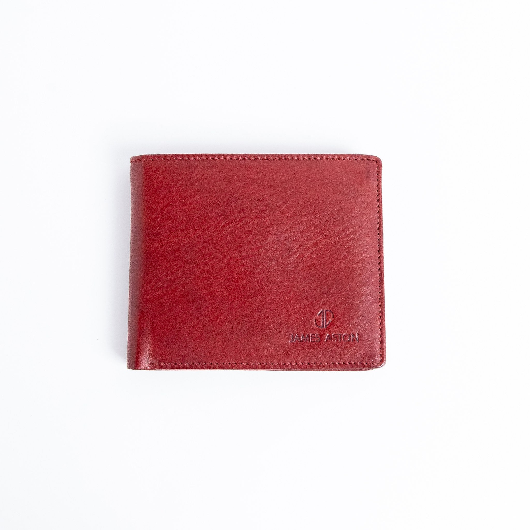 The Alonzo bifold wallet in red milled Vachetta leather, closed.