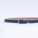 The Anna dress belt in blue Vachetta leather, full length, with brushed nickel buckle.
