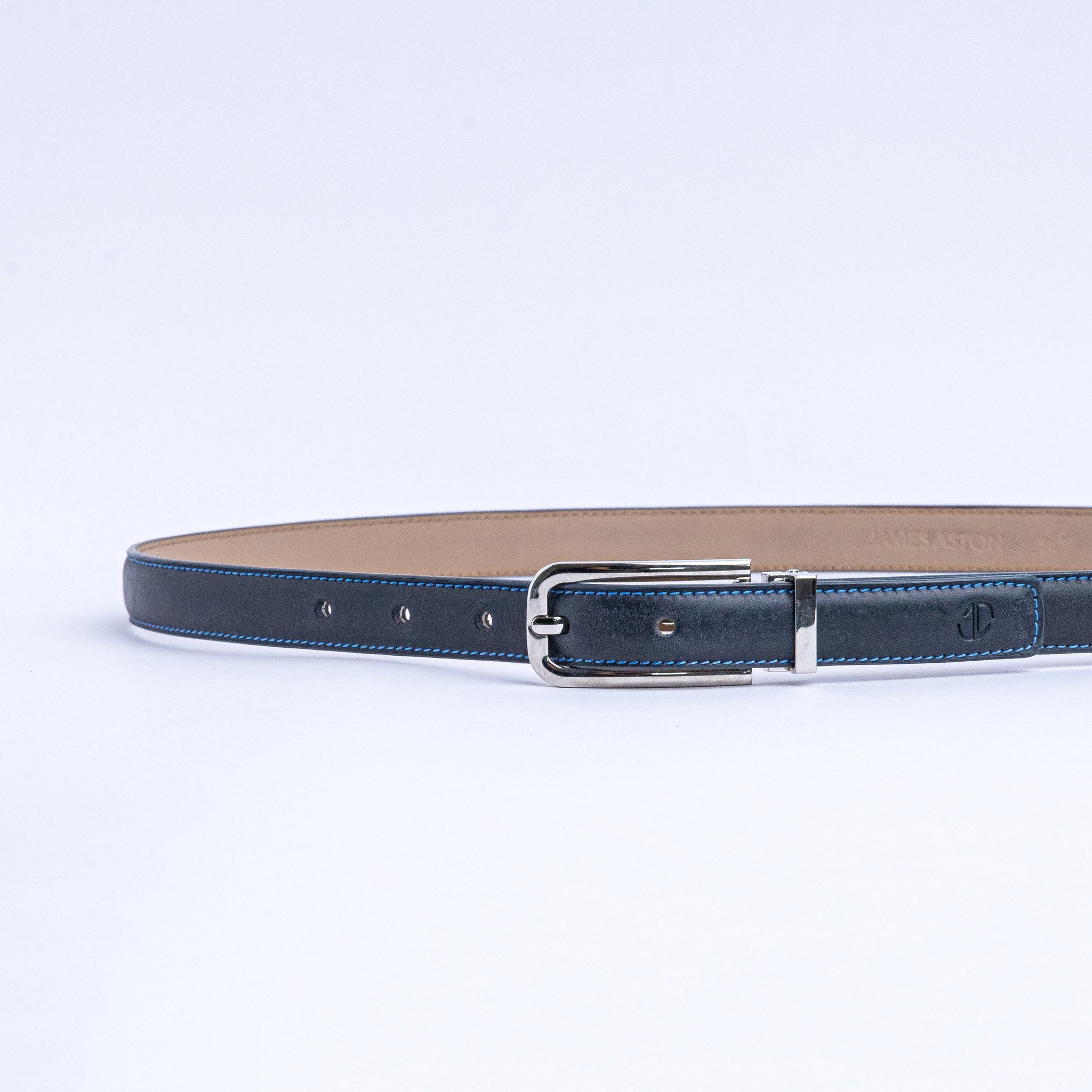 The Anna dress belt in blue Vachetta leather, full length, with brushed nickel buckle.