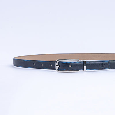 The Anna dress belt in blue Vachetta leather, full length, with brushed nickel buckle.