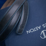 The grain of the Vachetta leather of the Anna dress belt in blue, up close.
