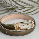 The Anna dress belt in olive Vachetta leather, composed.