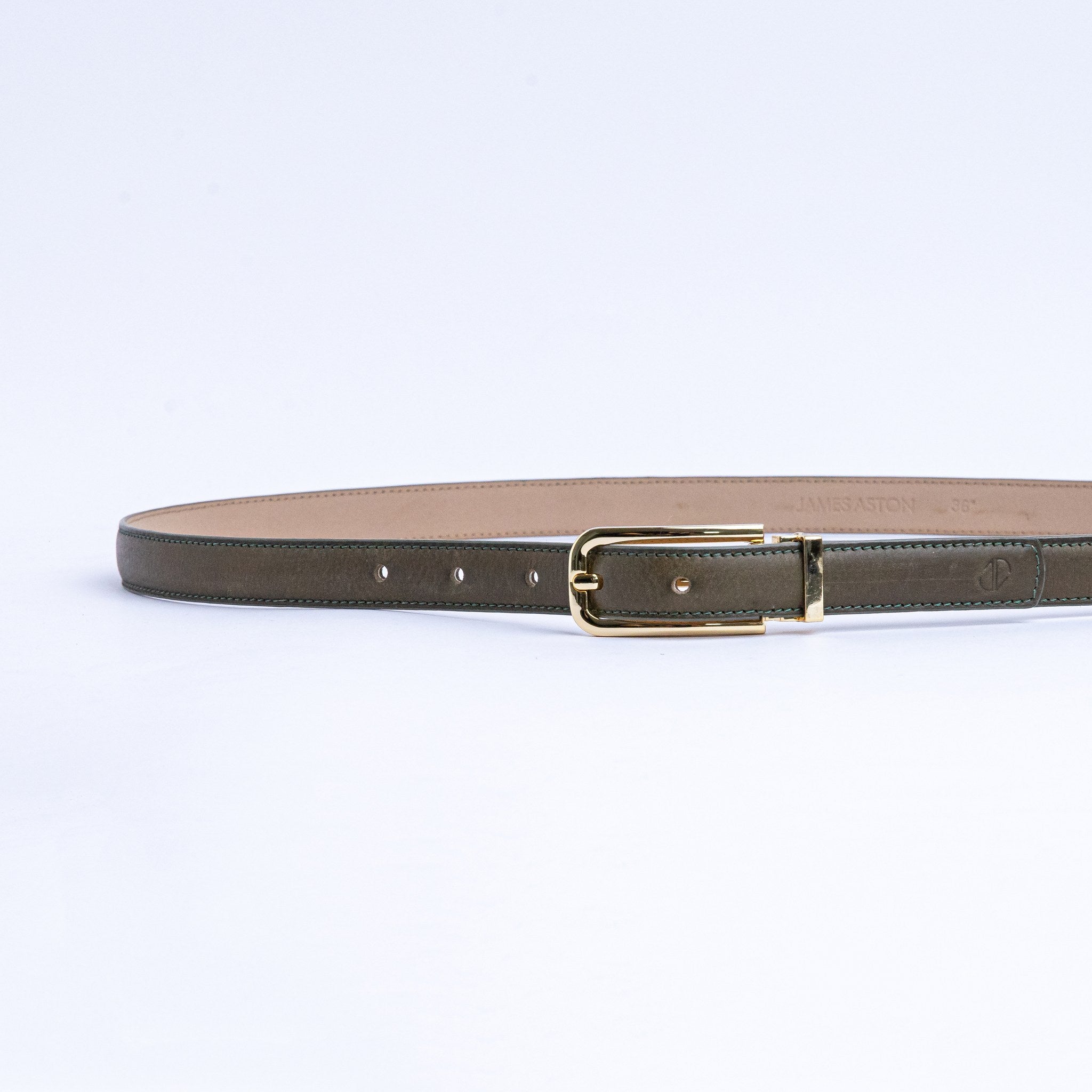 The Anna dress belt in olive Vachetta leather, full length, with gold buckle.