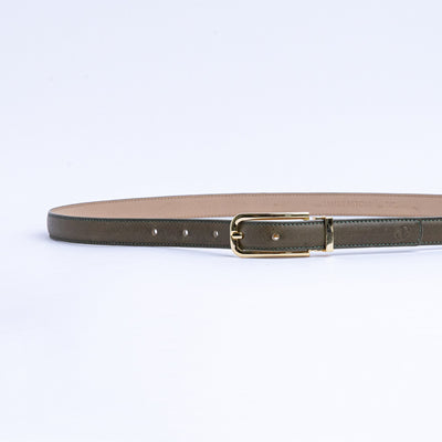 The Anna dress belt in olive Vachetta leather, full length, with gold buckle.