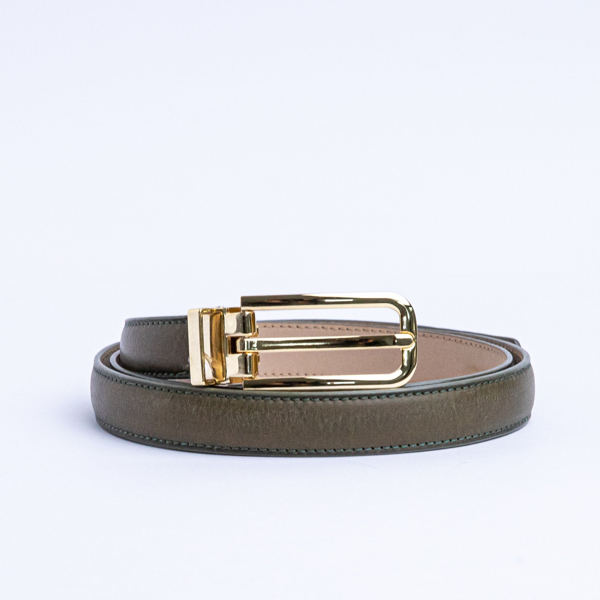 The Anna dress belt in olive Italian Vachetta leather, coiled.