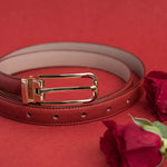 The Anna dress belt in red Vachetta leather, composed.