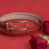 The Anna dress belt in red Vachetta leather, composed.