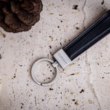 The Armando key holder in black Italian Vachetta leather, composed.