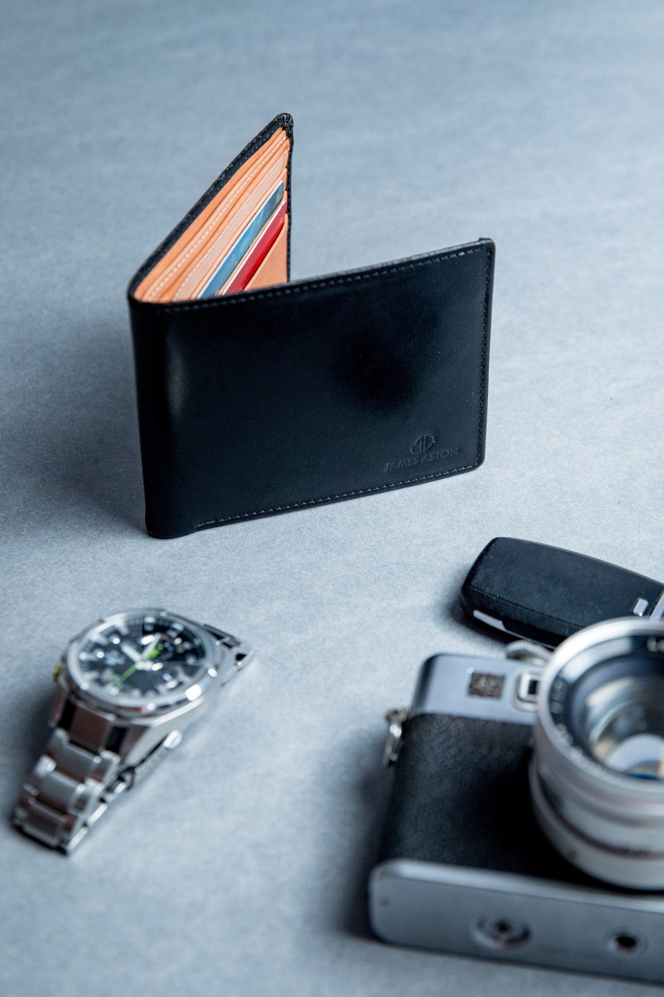 The Bristol bifold wallet in black English Bridle leather, composed.