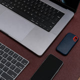 The large desk mat in Australian Nut on a working desk