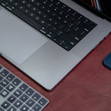 The large desk mat in Australian Nut across a broad table