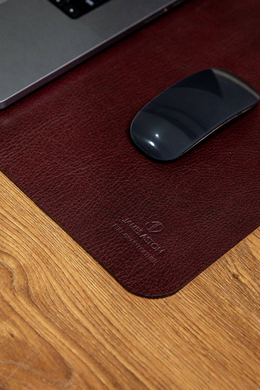 The desk mat in Australian Nut, edge and surface detail, medium