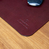 The full grain milled leather grain of the desk mat in Australian Nut