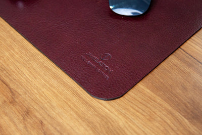 The full grain milled leather grain of the desk mat in Australian Nut