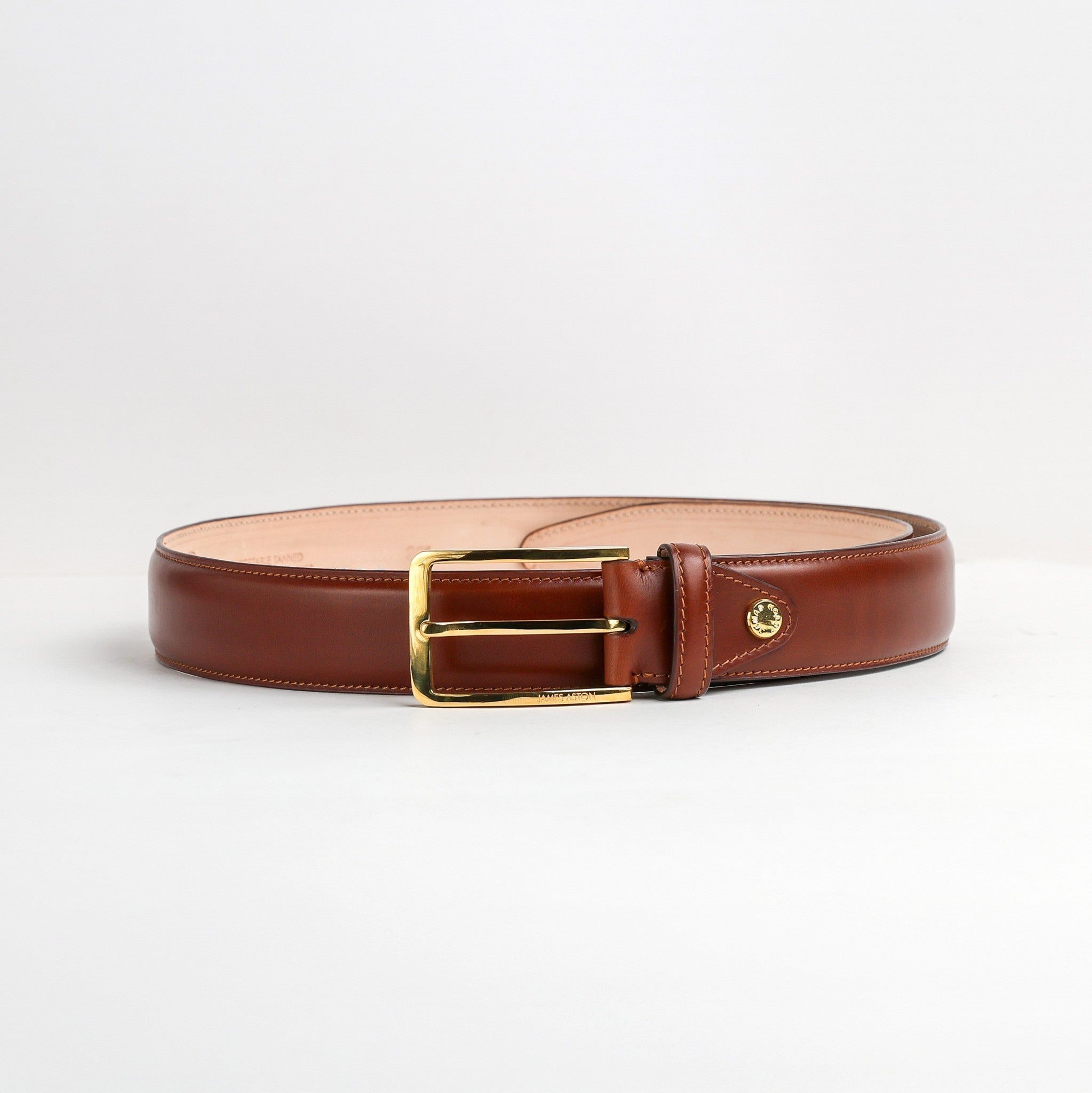 Gold buckle, Chicago screw and tone on tone stitching on The Lorenzo cognac Bridle belt