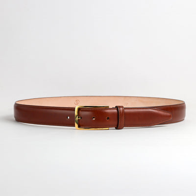 Full length of The Lorenzo cognac Italian Bridle leather belt with gold buckle, by James Aston