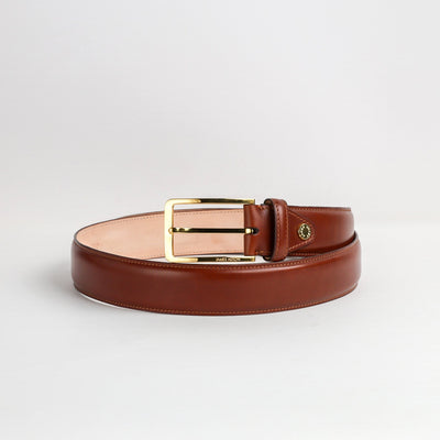 Gold buckle and keeper of The Lorenzo cognac Italian Bridle leather belt