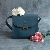 Ocean's Bloom blue leather handbag, a styled view.