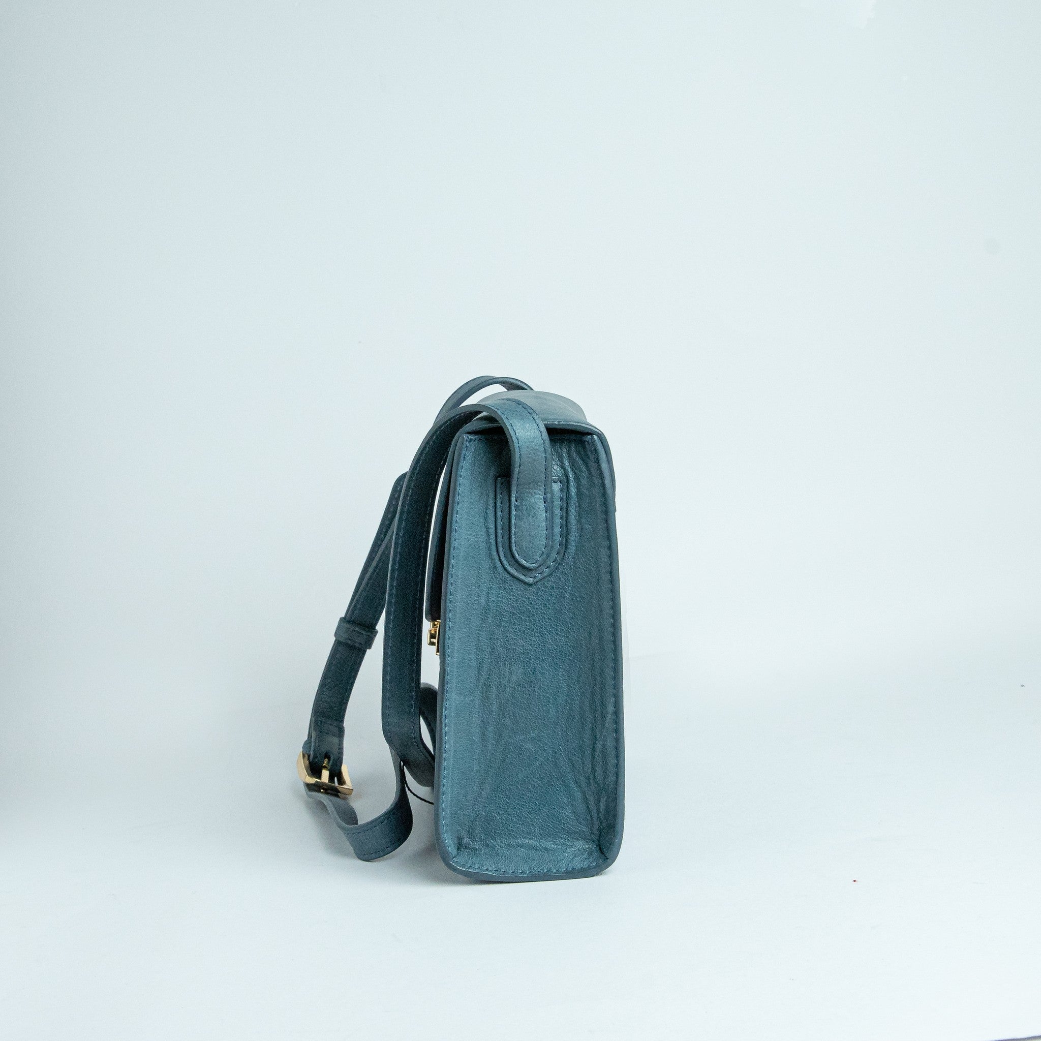 Side profile of Ocean's Bloom blue leather handbag.