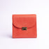Ocean's Bloom Spanish milled leather handbag in orange peach, front view.