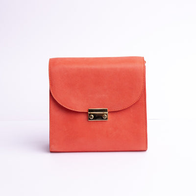 Ocean's Bloom Spanish vegetable tanned nubuck leather handbag in orange peach, by James Aston