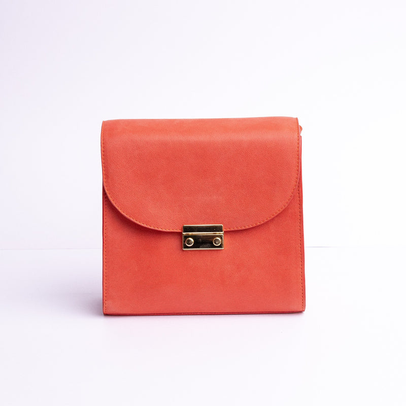 Ocean's Bloom Spanish vegetable tanned nubuck leather handbag in orange peach, by James Aston