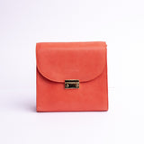 Ocean's Bloom Spanish vegetable tanned nubuck leather handbag in orange peach, by James Aston