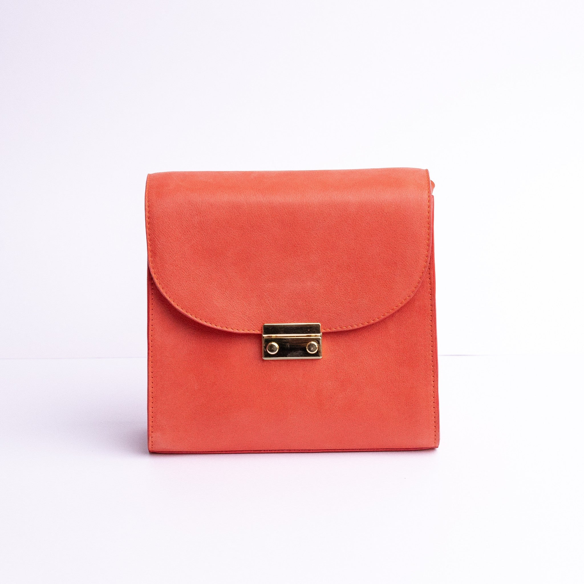 Ocean's Bloom Spanish vegetable tanned nubuck leather handbag in orange peach, by James Aston