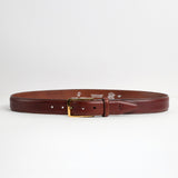 Full length of The Raffaello oak brown Italian milled Vachetta leather belt with gold buckle, by James Aston