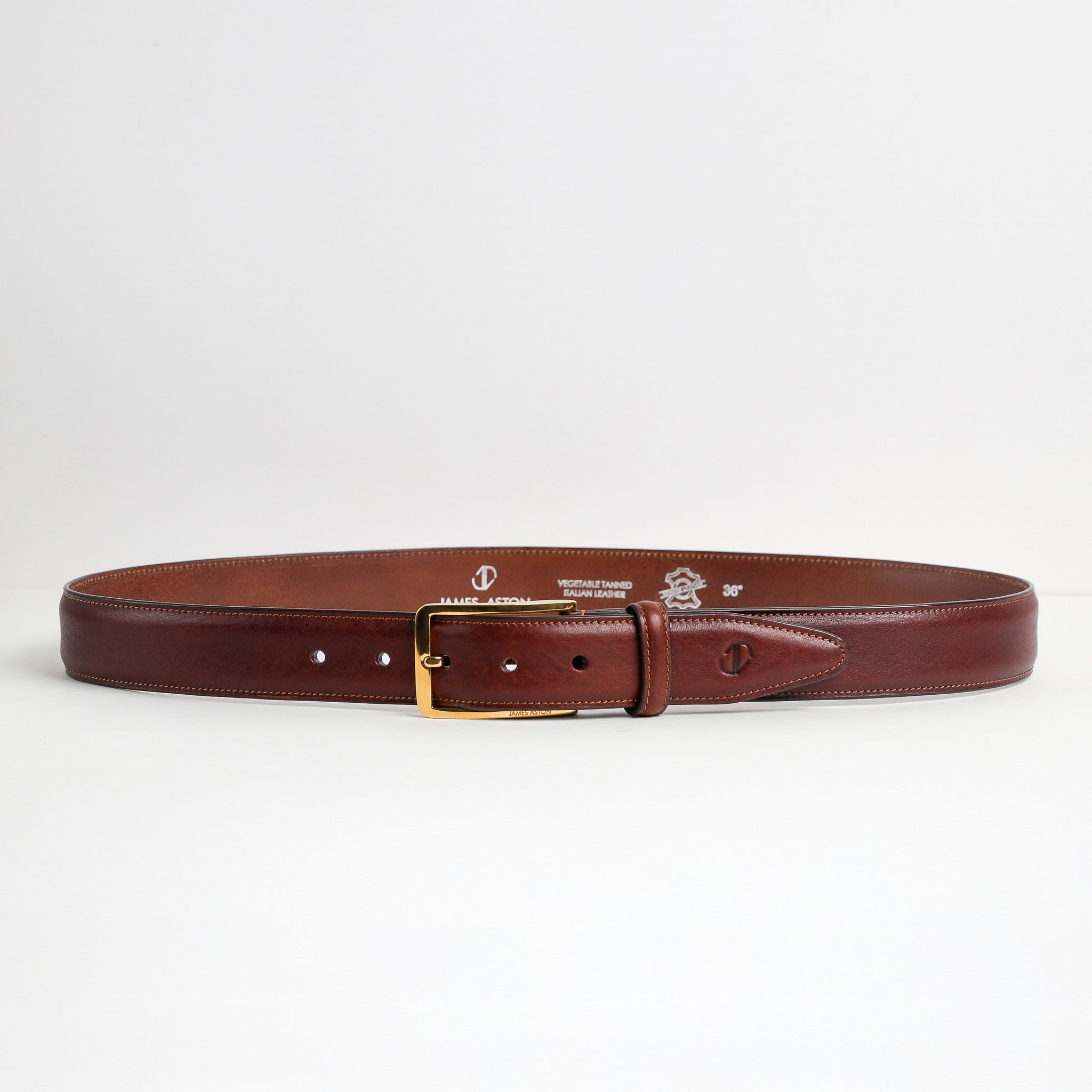Full length of The Raffaello oak brown Italian milled Vachetta leather belt with gold buckle, by James Aston