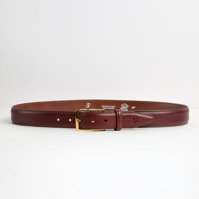 Full length of The Raffaello oak brown Italian milled Vachetta leather belt with gold buckle, by James Aston