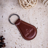 The Somerset key holder in cognac English Bridle leather, composed.