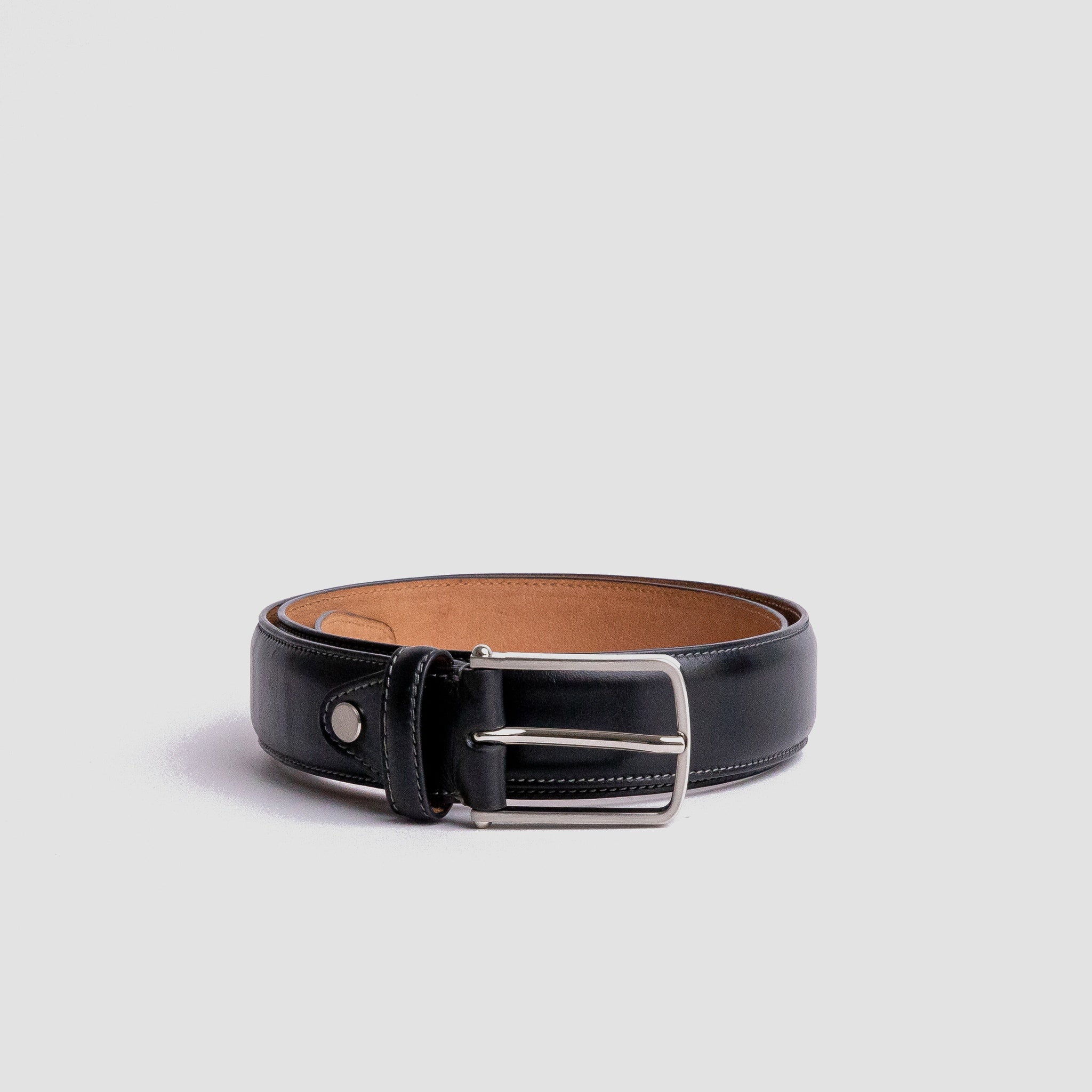 Close detail of the slightly raised full grain leather of The Amadeo in black, by James Aston