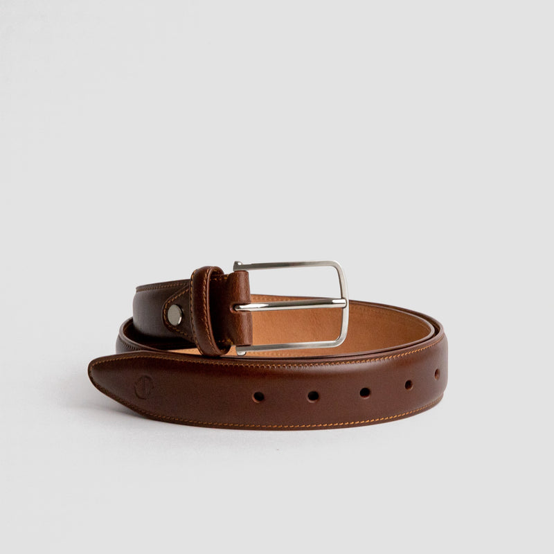 The Amadeo dress belt in cognac Spanish full grain vegetable tanned leather with a brush nickel buckle, by James Aston