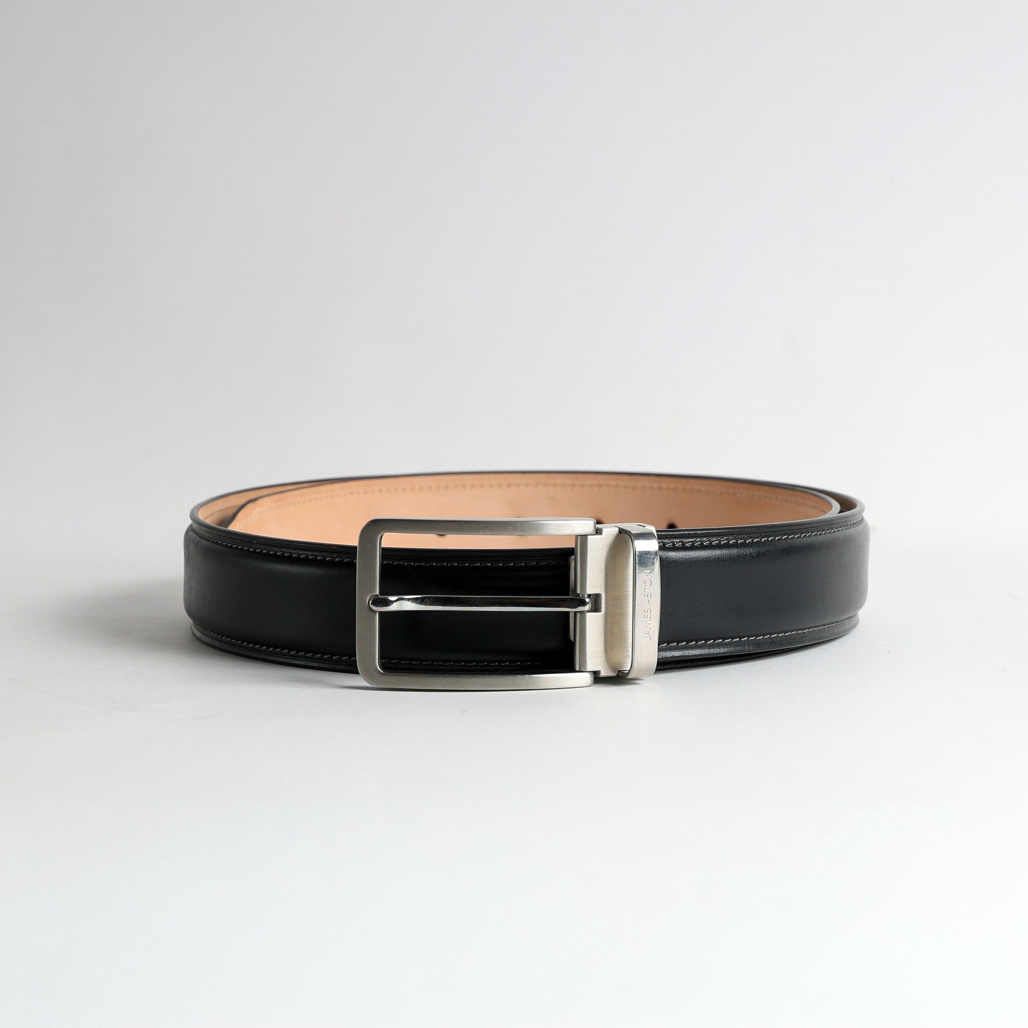 Nickel buckle and keeper of The Cesare Black Italian Bridle belt, with the engraved James Aston bar