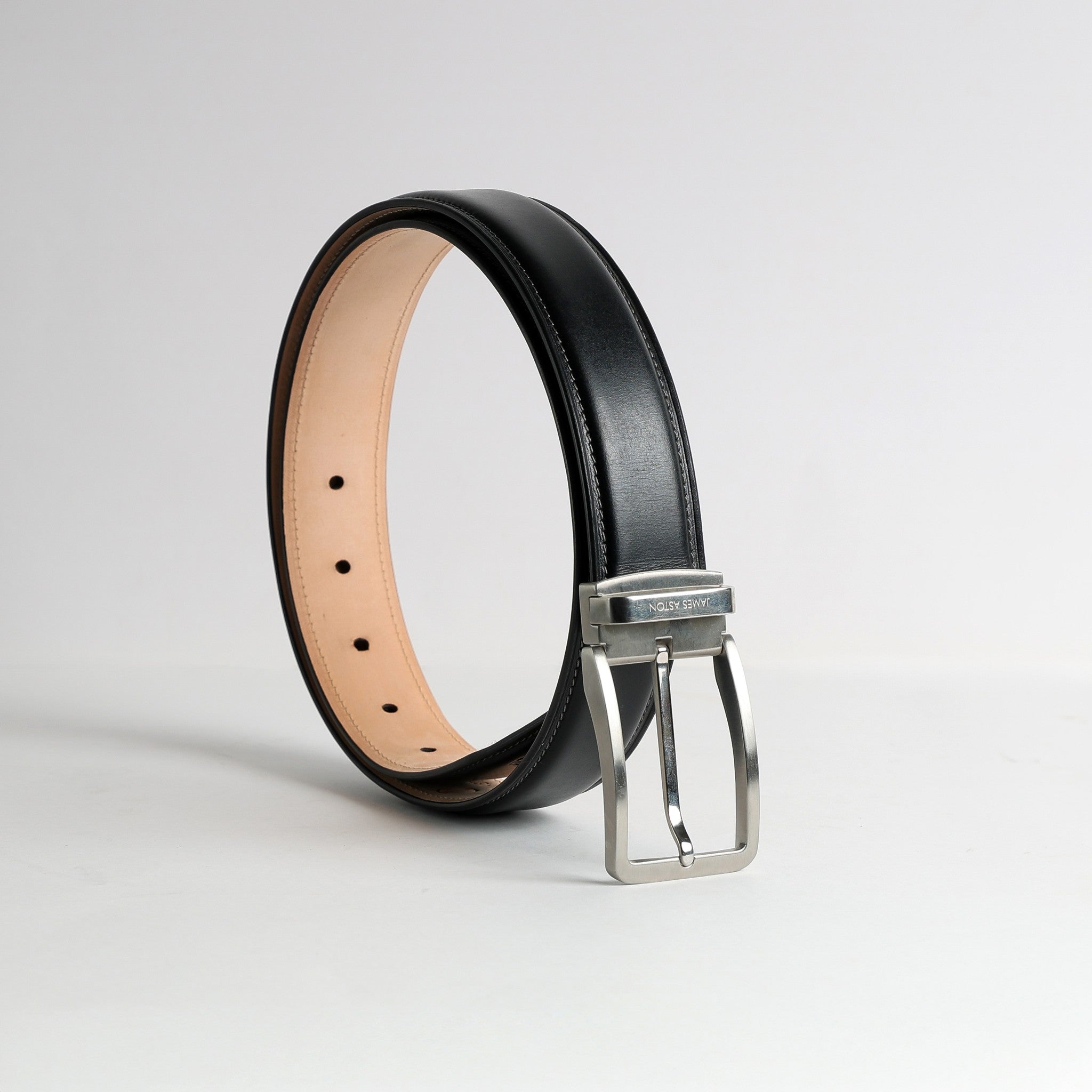 The Cesare belt in Black Italian vegetable tanned Bridle leather, with its nickel buckle, by James Aston