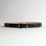 The Cesare black Bridle leather belt flat lay showing embossed JA mark on billet tip and engraved James Aston keeper