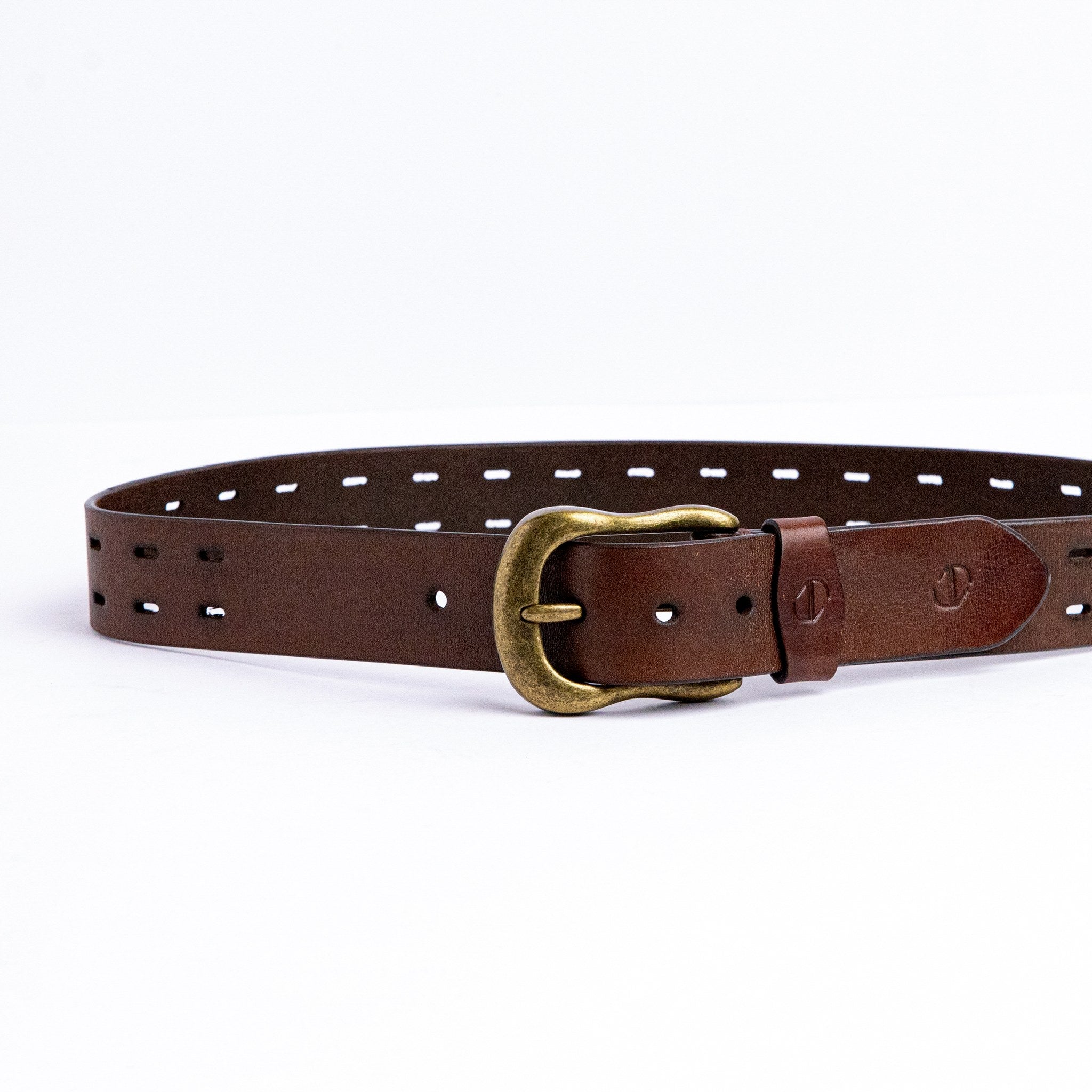 The Damian belt in cognac milled leather shown at full length, with dull brass buckle