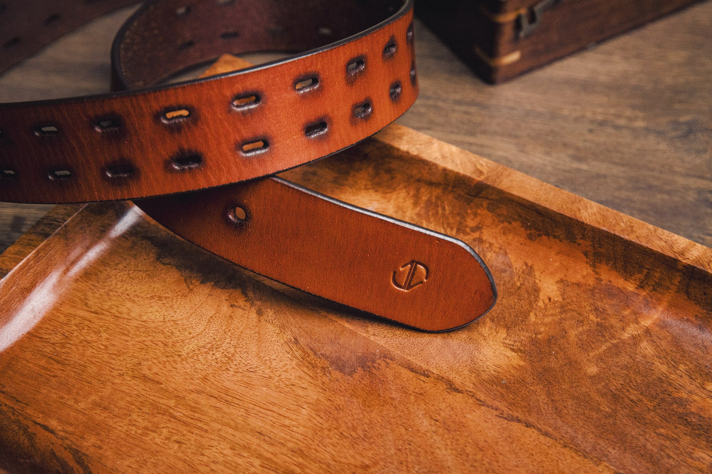 Close view of the milled leather grain of the Damian belt in tan