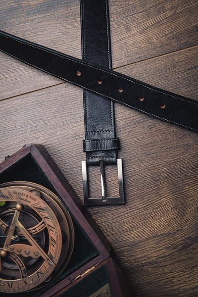 The Eduardo in Black, Spanish full grain milled leather belt, composed still life