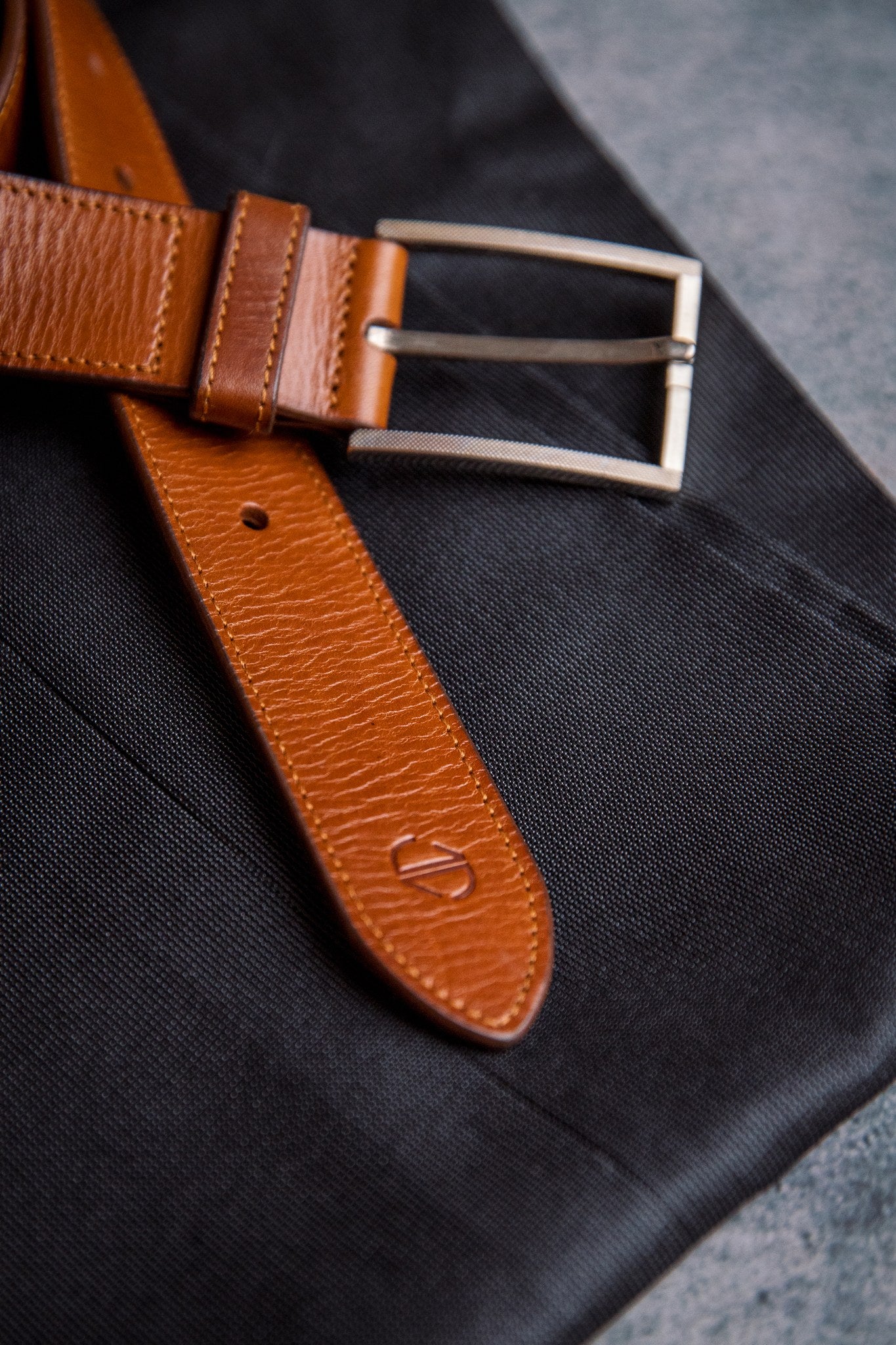 The Eduardo in Tan, machine stitched edges with buckle fastened by hand stitching